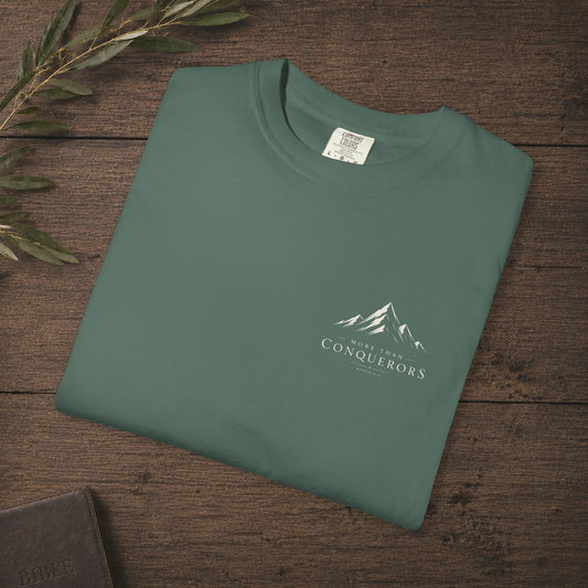 More than Conquerors — Romans 8:37 Subtle Scripture Tee | Chest Print